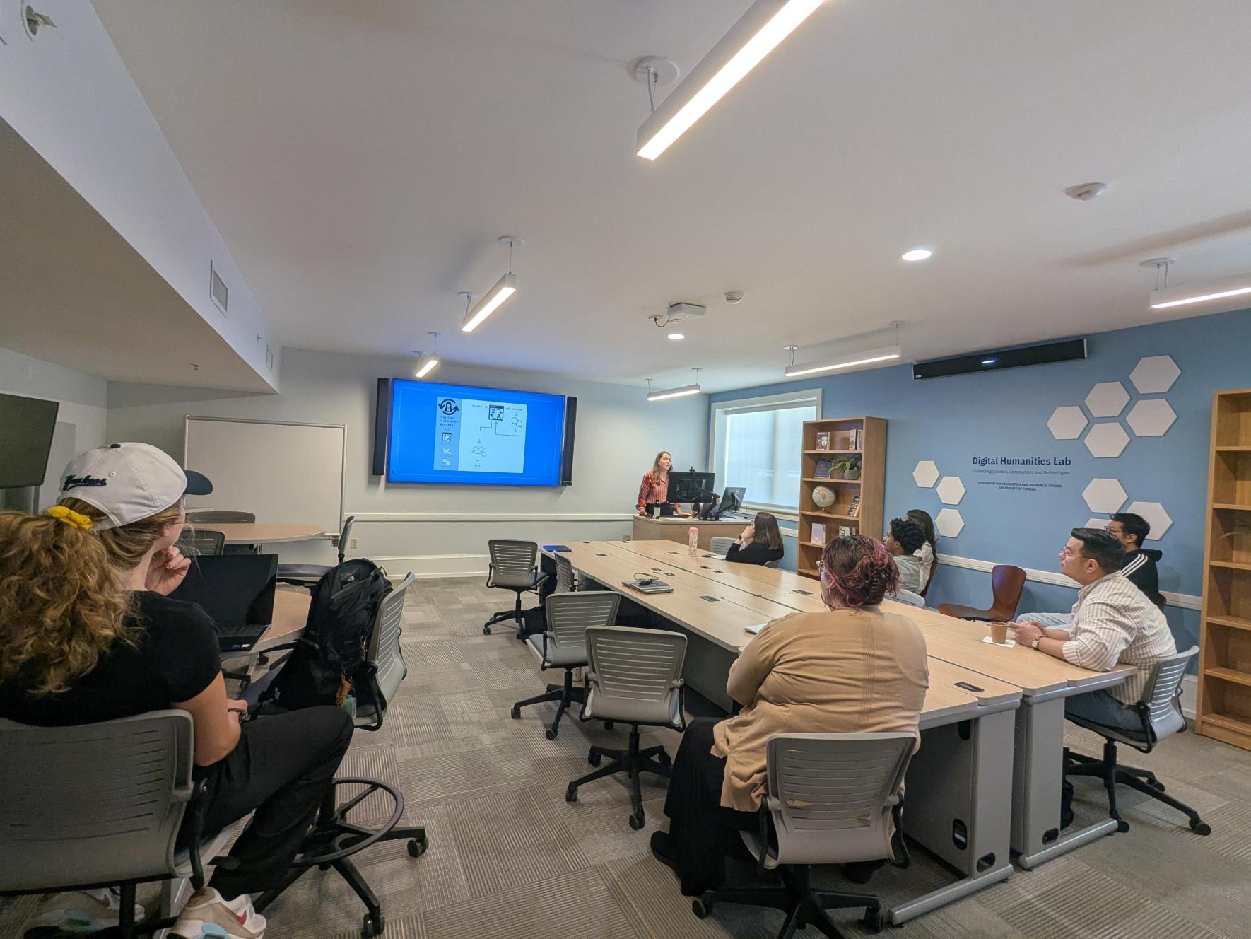 viewers at the Florida meetup viewing a presentation